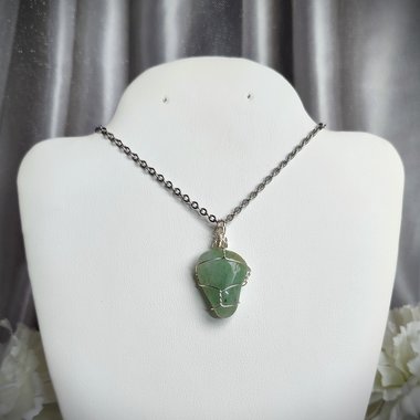 Green aventurine wire wrapped pendant in silver.