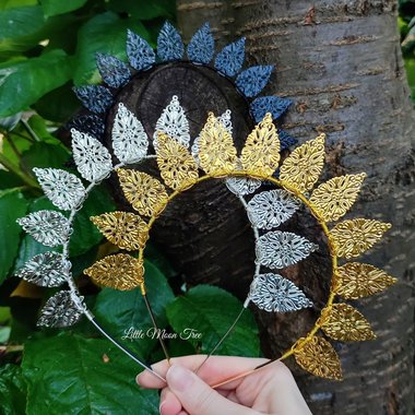 Halo crowns with filigree teardrops in silver, gold or black.
