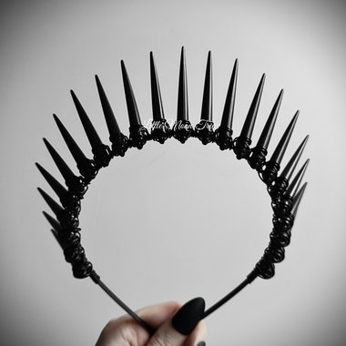 Necro crown with black spikes wire wrapped onto a headband.